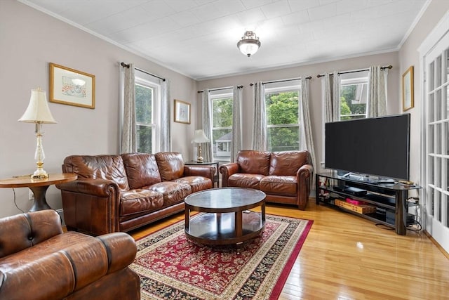 24-26 Lincoln St, North Andover, MA 01845 - living area featuring healthy amount of natural light, light wood finished floors, and ornamental molding