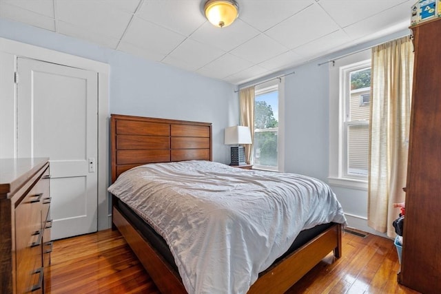 24-26 Lincoln St, North Andover, MA 01845 - bedroom with wood-type flooring and a paneled ceiling