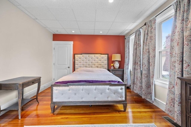 24-26 Lincoln St, North Andover, MA 01845 - bedroom with multiple windows, wood finished floors, a drop ceiling, and recessed lighting
