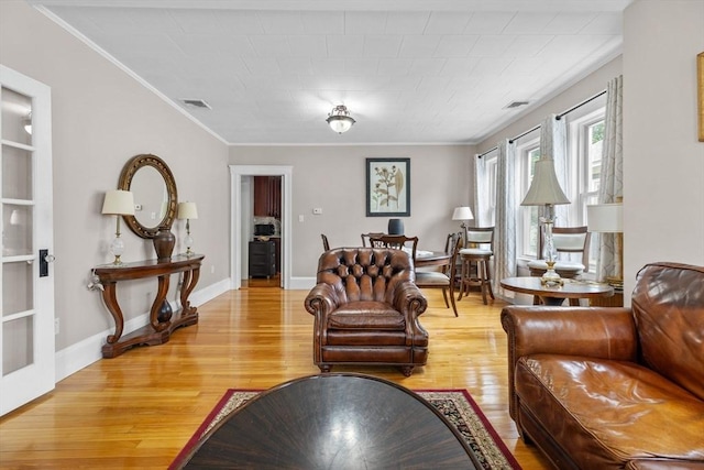 24-26 Lincoln St, North Andover, MA 01845 - living room with light wood-style floors and crown molding