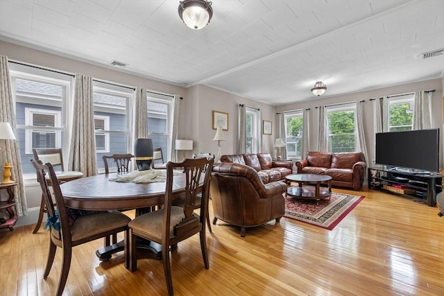 24-26 Lincoln St, North Andover, MA 01845 - dining room featuring light wood finished floors and crown molding
