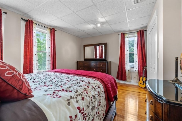 24-26 Lincoln St, North Andover, MA 01845 - bedroom with a drop ceiling, multiple windows, and wood finished floors