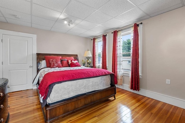 24-26 Lincoln St, North Andover, MA 01845 - bedroom with wood-type flooring and a paneled ceiling