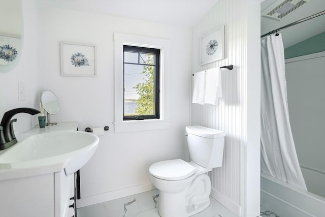 full bathroom featuring vanity, toilet, and shower / bath combo with shower curtain