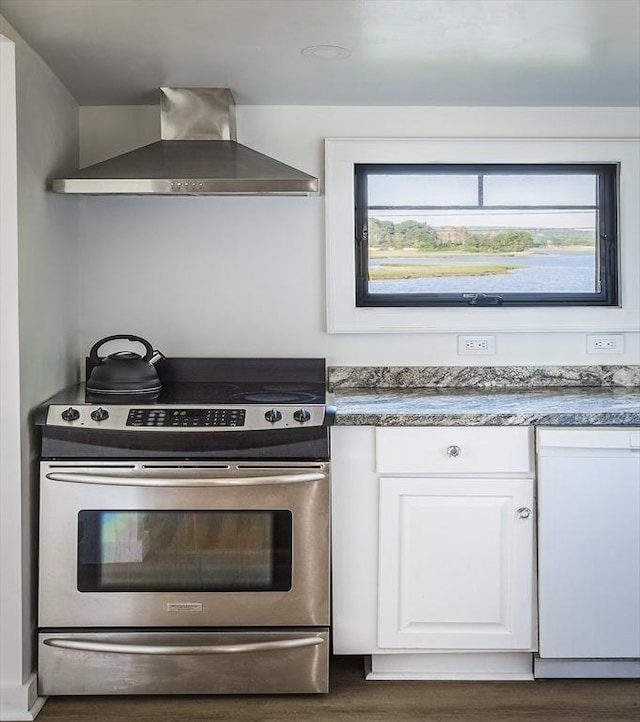 kitchen featuring electric range, wall chimney exhaust hood, dark hardwood / wood-style floors, white dishwasher, and white cabinets