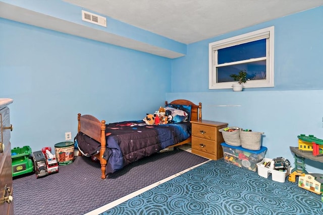 carpeted bedroom with visible vents