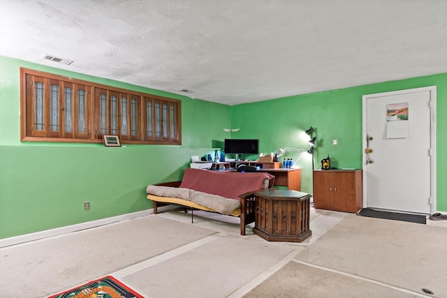 office area with visible vents and baseboards