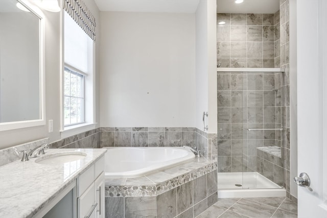 bathroom with vanity, tile patterned floors, and separate shower and tub