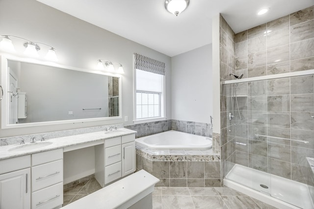 bathroom with vanity and separate shower and tub