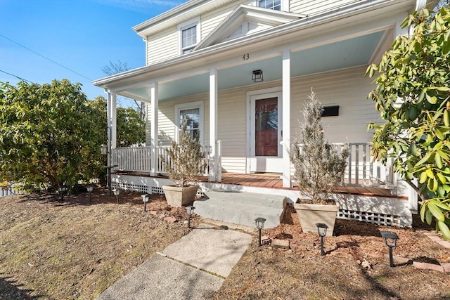 property entrance with covered porch