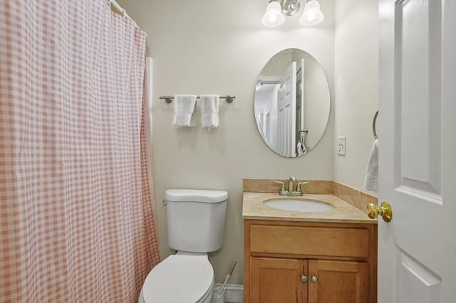 full bath featuring toilet, a shower with shower curtain, and vanity