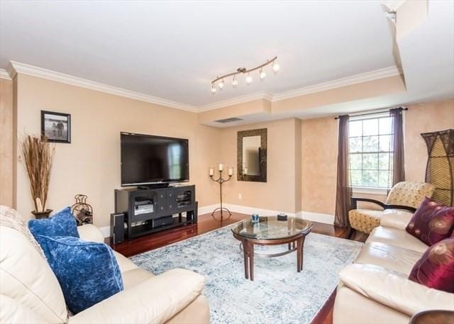 255 Winter St Unit 305, Waltham, MA 02451 - living room with ornamental molding and wood finished floors