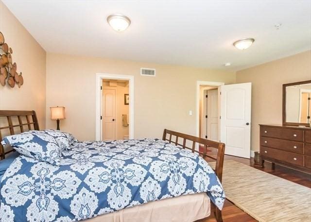 255 Winter St Unit 305, Waltham, MA 02451 - bedroom with wood finished floors and ensuite bathroom