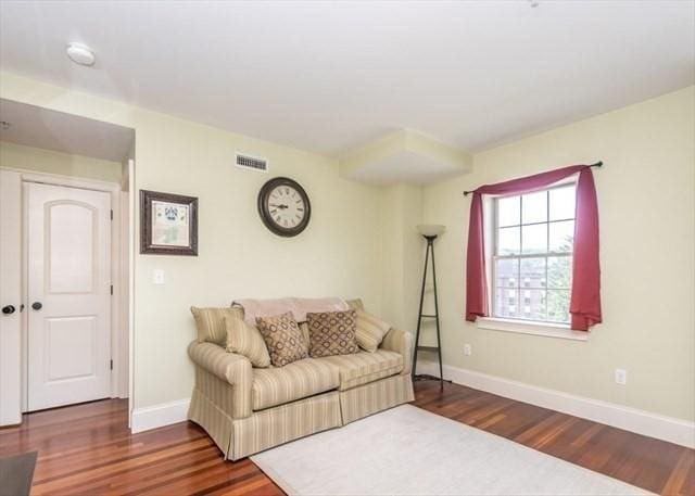 255 Winter St Unit 305, Waltham, MA 02451 - living room with wood finished floors and baseboards