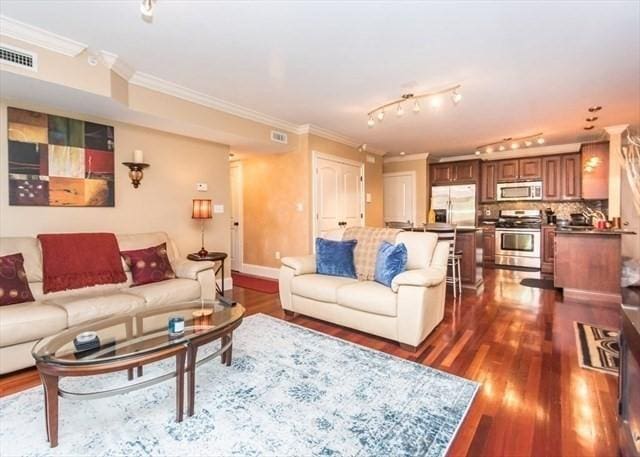 255 Winter St Unit 305, Waltham, MA 02451 - living area featuring ornamental molding and dark wood-style flooring