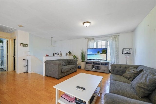 1249-1251 Rockdale Ave, New Bedford, MA 02740 - living area with attic access and light wood-style flooring