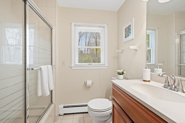 full bath featuring tile patterned flooring, a baseboard radiator, vanity, and toilet