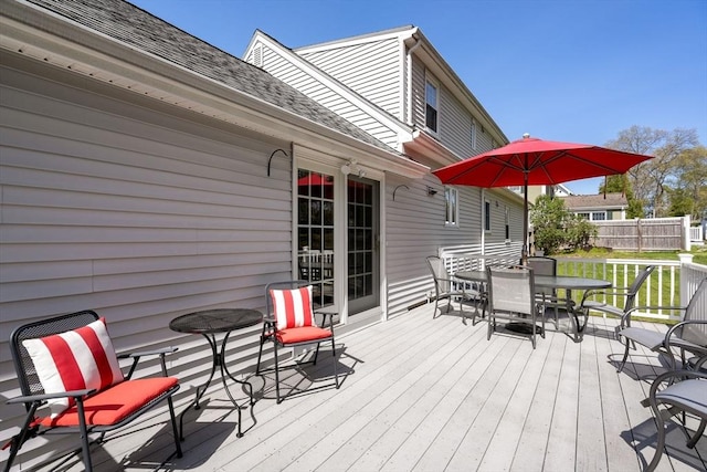 deck featuring outdoor dining area