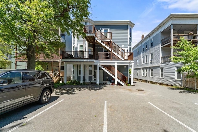 23 Dix St Unit 1, Boston, MA 02122 - view of building exterior featuring stairway and uncovered parking