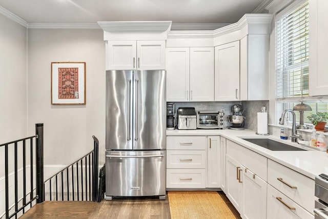 23 Dix St Unit 1, Boston, MA 02122 - kitchen featuring high end fridge, a sink, light wood-style floors, light countertops, and white cabinetry