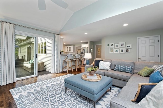 living area featuring vaulted ceiling, wood finished floors, a ceiling fan, and recessed lighting