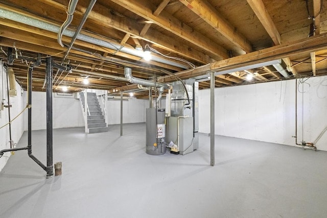 unfinished basement with water heater, stairway, and heating unit