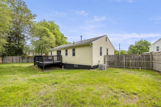 rear view of house with a wooden deck and central air condition unit