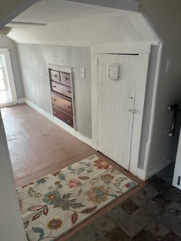 tiled entrance foyer with lofted ceiling