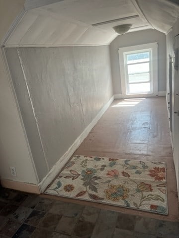 additional living space featuring vaulted ceiling