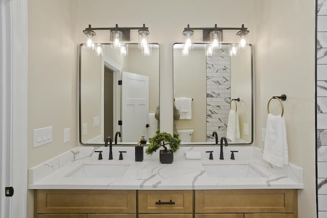 bathroom with vanity and toilet