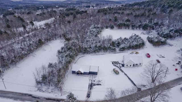 snowy aerial view with a mountain view