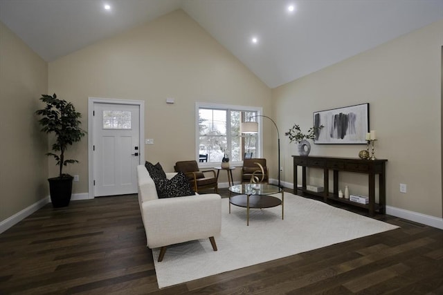 living room featuring dark wood-type flooring and high vaulted ceiling