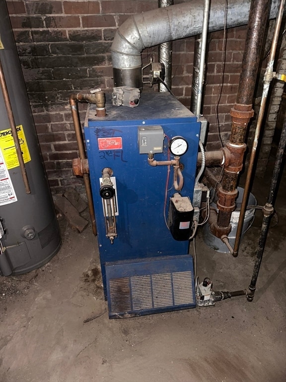 utility room featuring gas water heater