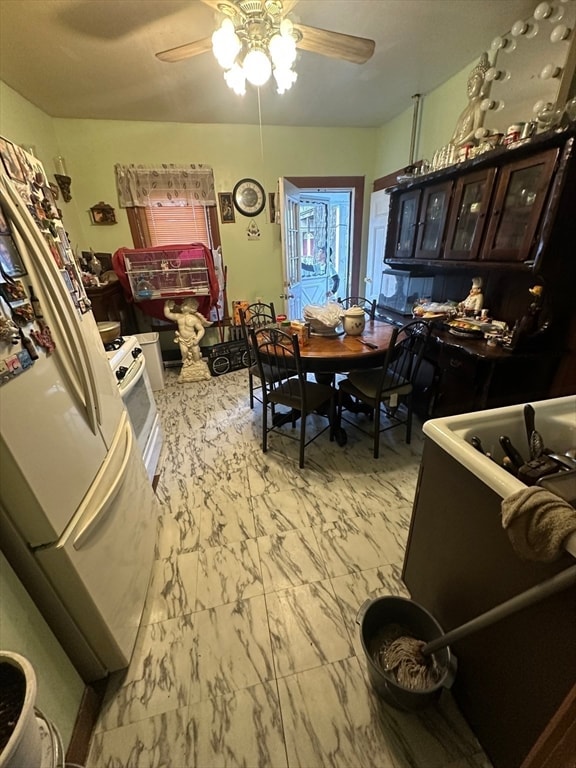 dining space featuring ceiling fan