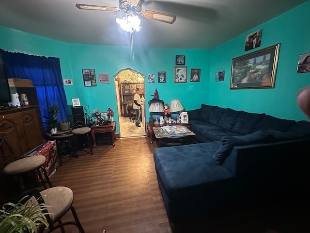 living room with hardwood / wood-style floors and ceiling fan