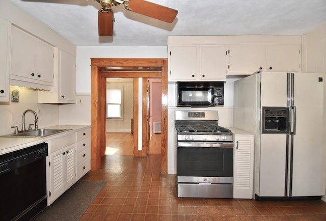 kitchen featuring black appliances, ceiling fan, white cabinetry, and sink