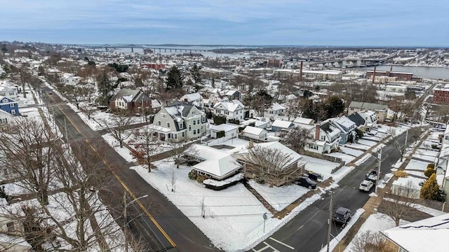 snowy aerial view with a residential view