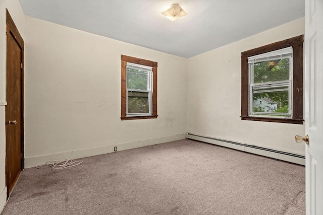 19-21 Pleasant St, North Andover, MA 01845 - empty room with a baseboard radiator and carpet floors