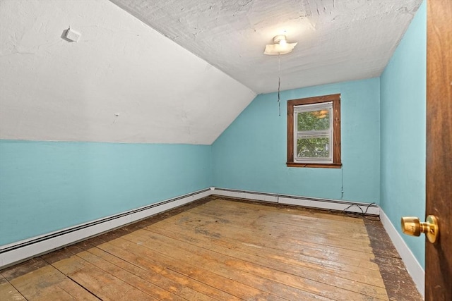 19-21 Pleasant St, North Andover, MA 01845 - bonus room with vaulted ceiling, baseboards, a baseboard radiator, and wood-type flooring