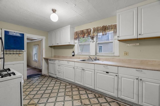 19-21 Pleasant St, North Andover, MA 01845 - kitchen featuring white appliances, a sink, white cabinets, and healthy amount of natural light