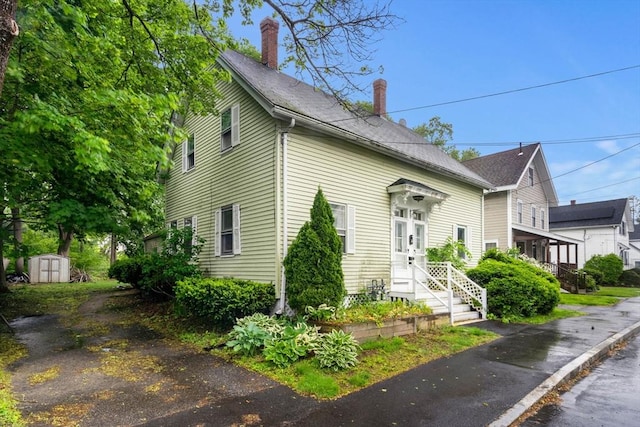 19-21 Pleasant St, North Andover, MA 01845 - view of front of house with a chimney