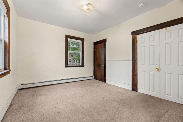 19-21 Pleasant St, North Andover, MA 01845 - unfurnished bedroom with a baseboard heating unit and carpet floors