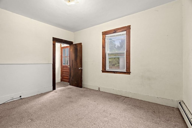 19-21 Pleasant St, North Andover, MA 01845 - carpeted spare room featuring a baseboard heating unit