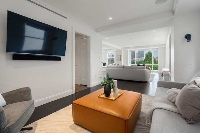 living room featuring ornamental molding and dark hardwood / wood-style flooring