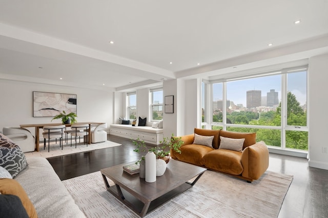 living room featuring a wealth of natural light and hardwood / wood-style flooring