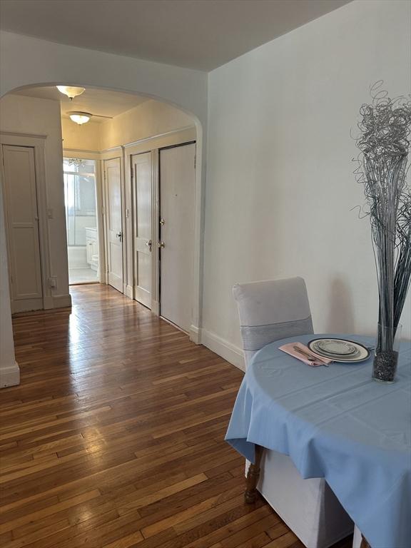 dining area with dark wood-type flooring