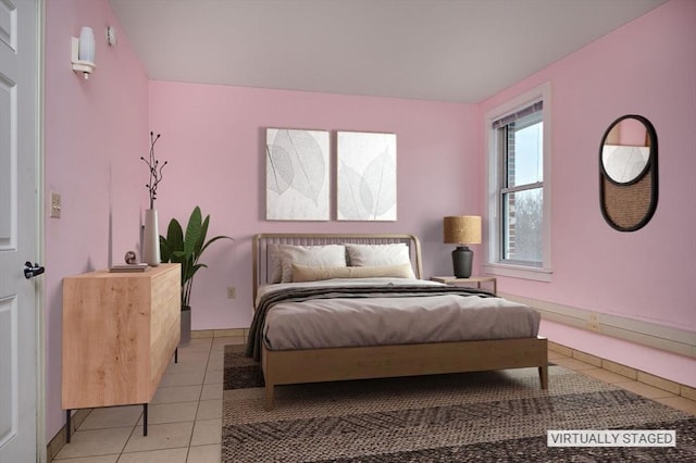 bedroom featuring light tile patterned flooring