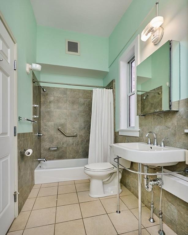 full bath with visible vents, shower / bathtub combination with curtain, toilet, tasteful backsplash, and tile patterned flooring