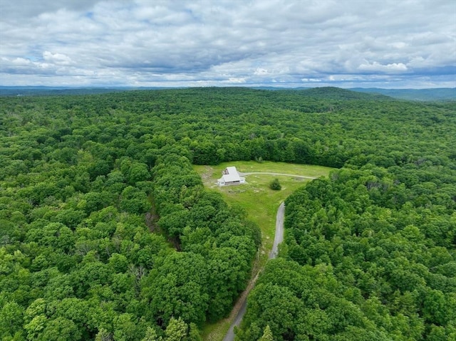 birds eye view of property with a wooded view