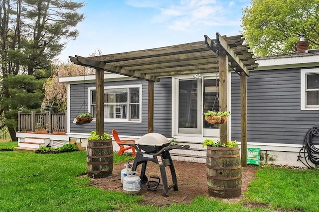 rear view of property with a pergola, a deck, and a yard